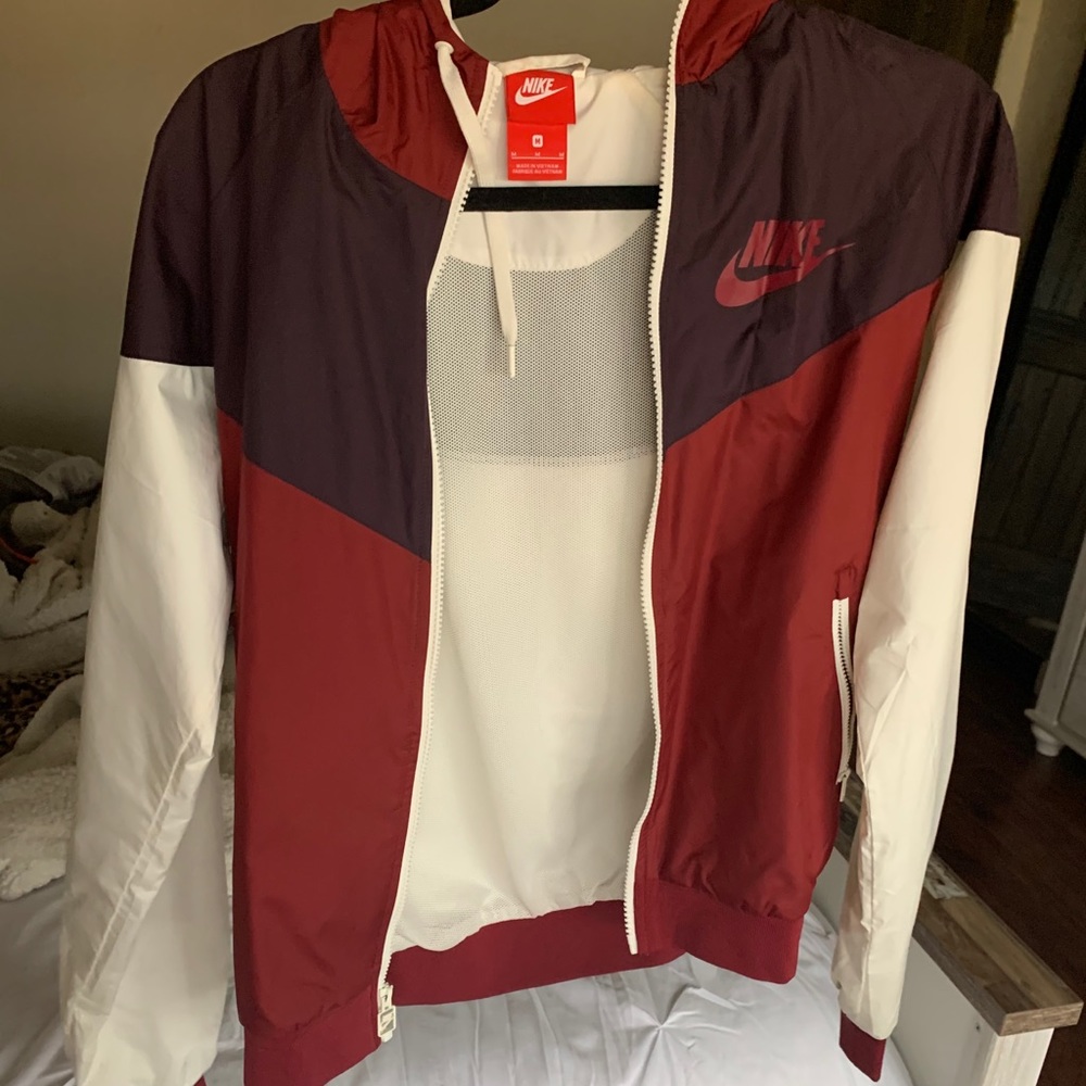 Red women’s windbreaker Nike
